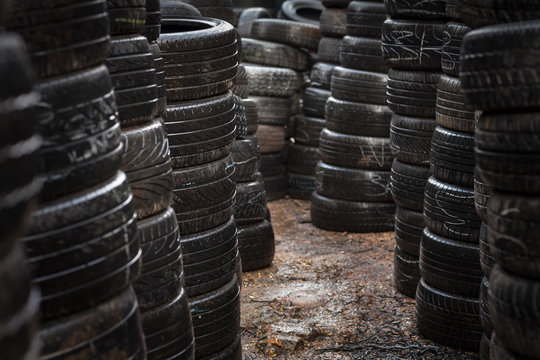 Car tyres stacked in a tyre distribution centre