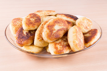 potato patties in a glass dish