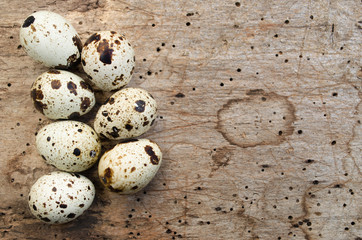 Quail eggs on wooden background