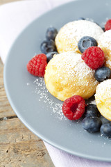 Traditional danish pancakes - ebelskivers with fresh berries