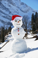Snowman against Alpine panorama