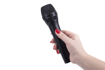 Female hand with a microphone.