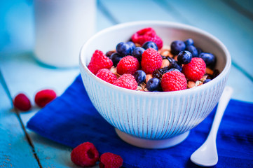 Granola with berries and almonds in a bowl