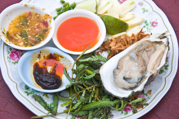 opened oysters with Thai spicy garlic and chili