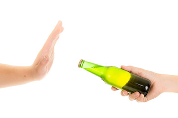 hand rejects a bottle of beer