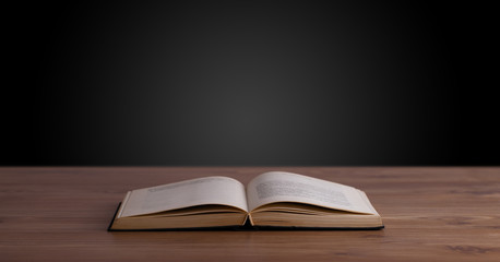 Open book on wooden deck