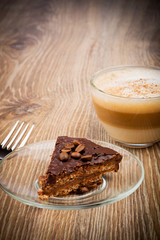 Cup of coffee latte and a cake