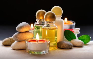 Spa stones, candle and shampoo