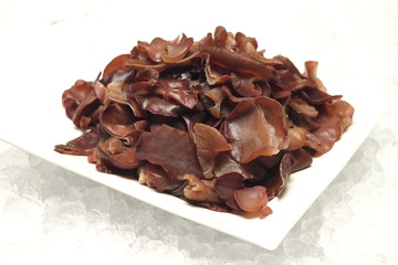 fresh fungus mushroom on big plate