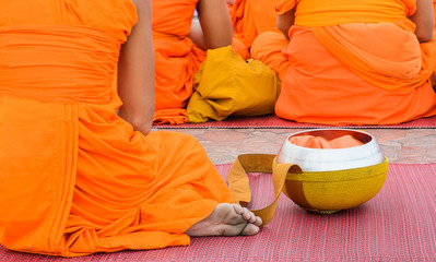 Buddhist monk with alms bowl