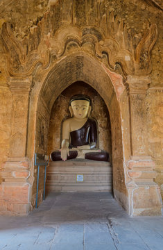 Ancient seated buddha statue in Bagan temple, Myanmar