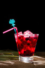 Raspberry cocktail on the sand