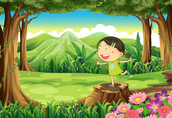 Obraz na płótnie Canvas A cute child above the stump at the forest