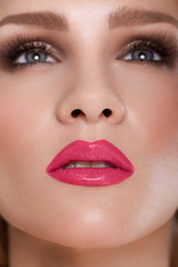 Naklejka premium Red Lips. Beauty Red Lip Makeup Detail. Beautiful Make-up 
