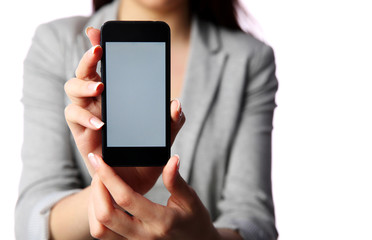 Businesswoman showing smartphone screen