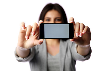 Woman showing smartphone screen isolated on white background