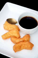deep-fried dough stick in Chinese style with black coffee.