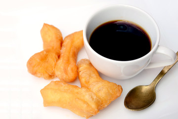 deep-fried dough stick in Chinese style with black coffee.