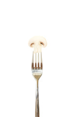 Slice of mushroom pinned on a fork