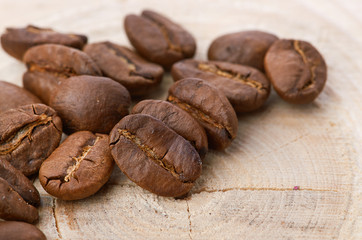 Coffee beans on wood background