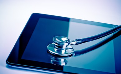 medical stethoscope on modern digital tablet in laboratory