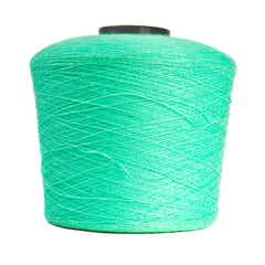 reel with turquoise yarn on white background