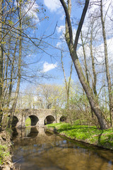 Fototapeta na wymiar baroque bridge in Vlci Dul near Zasmuky, Czech Republic