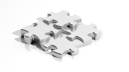 Silver jigsaw puzzle pieces isolated on white background