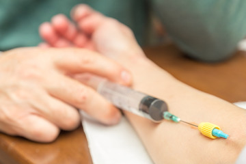 Doctor / Nurse  injects medicine intravenously