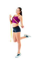 Fototapeta na wymiar young woman holding a measure tape around her waist