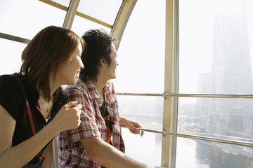 couple getting on Ferris wheel