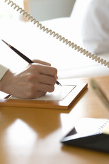hand of person taking note