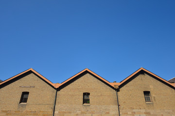 Fototapeta na wymiar Brick wall with blue sky