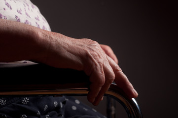 Hands Senior in wheelchair