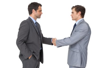 Smiling business team shaking hands