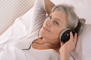 Senior lady in headphones