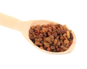 Wooden spoon with raisins.