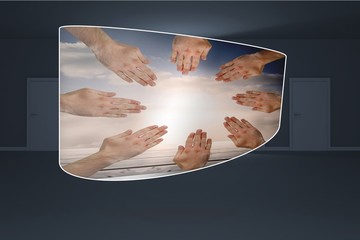 Composite image of hands together on abstract screen