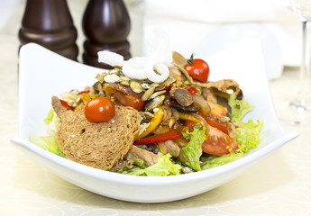 Warm salad of beef and vegetables in a restaurant
