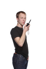Fototapeta na wymiar Young security officer talking through his walkie talkie.