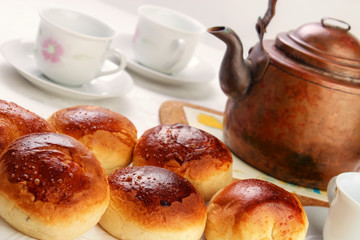 Home baked sweet buns with old copper pot
