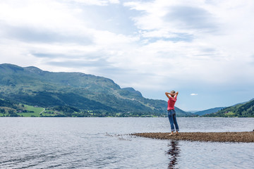 Fototapeta na wymiar Enjoyment - free happy woman enjoying landscape