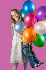 Fototapeta na wymiar Children with multi-colored spheres