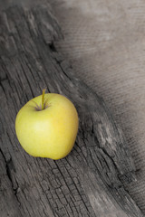 Apple on wooden board