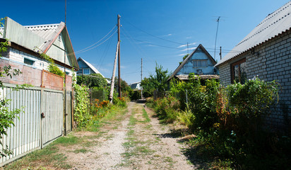 Fototapeta na wymiar Street in the Village with old houses