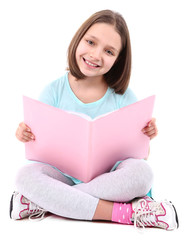 Beautiful little girl with book, isolated on white