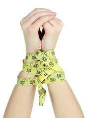 Fototapeta premium Woman hands with measuring tape isolated on white