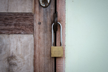 Old master key on wood door