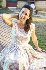 Fototapeta premium Woman gardening. Mature girl gardening in her backyard. spring s