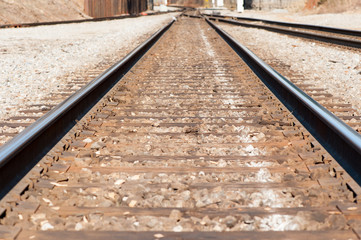 railroad tracks with cross ties and rails